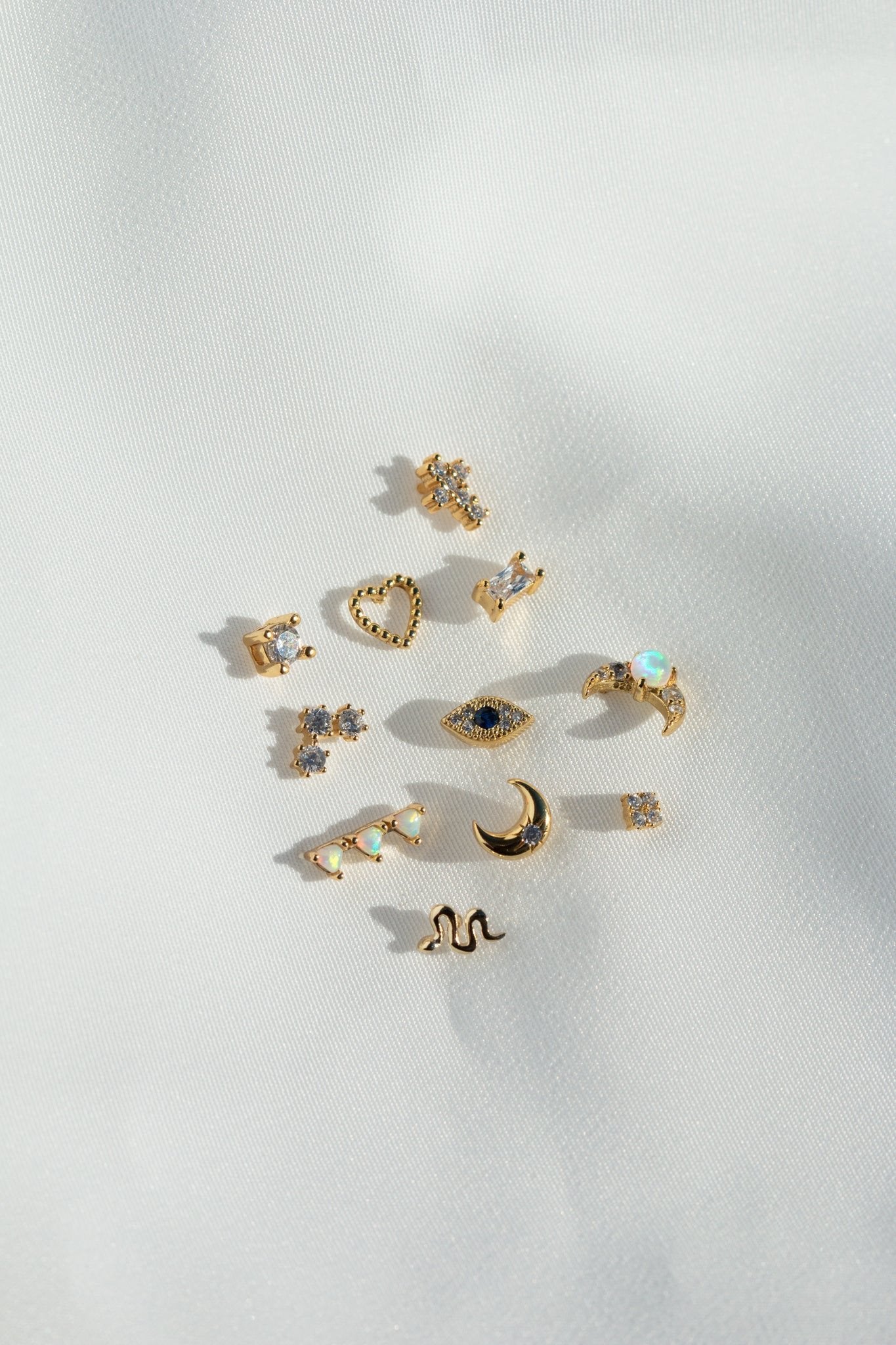 dainty mini stud earrings in gold by vie en bleumini snake studs, snake studs, snake earrings, snake stud earring, small snake stud, snake earring gold, gold stud earring, gold snake stud, mini snake stud, snake earring, snake jewelry, dainty snake, dainty snake earring